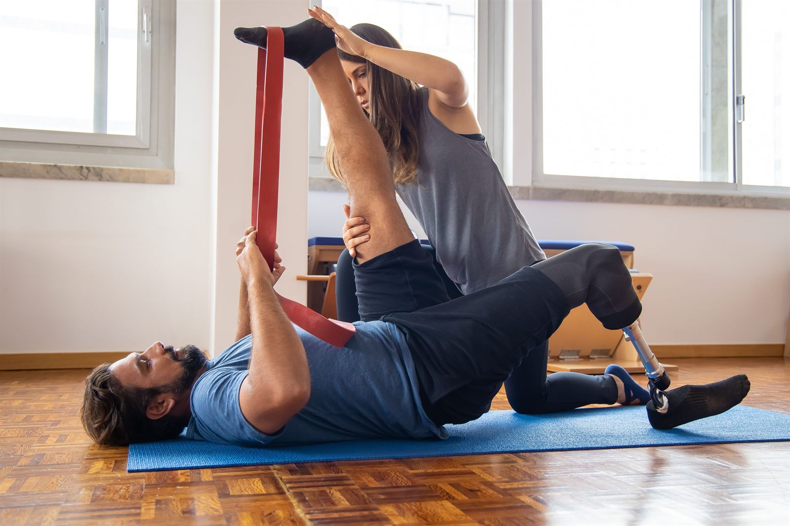A Saddle Health clinician working with a student-athlete during a therapy session.